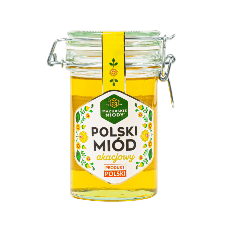 Słoik z klamrą 550 g polskiego miodu akacjowego – naturalny produkt pszczeli o jasnej barwie i delikatnym smaku.